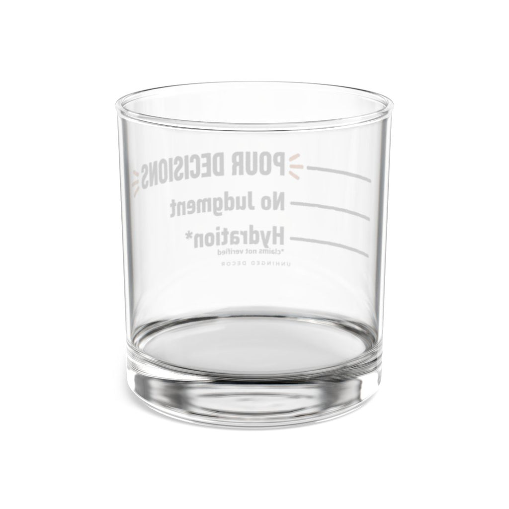 Back view through the clear Pour Decision rocks glass, pour lines Hydration* → No Judgment → POUR DECISIONS reversed, Unhinged Decor.