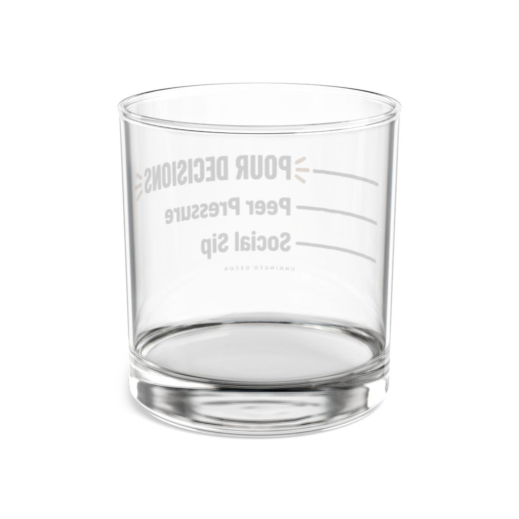 Back view through the clear Pour Decision rocks glass, pour lines Social Sip → Peer Pressure → POUR DECISIONS reversed, Unhinged Decor.