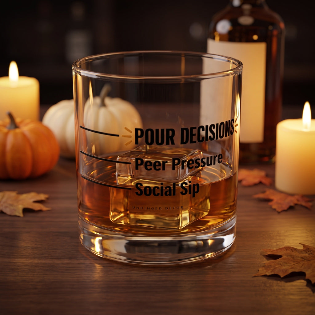 Pour Decision rocks glass 'Social Sip / Peer Pressure' with whiskey on a big ice cube on a fall home bar with candles and pumpkins, Unhinged Decor