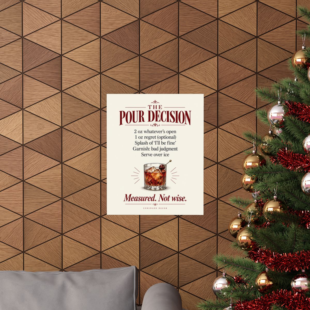 The Pour Decision recipe print hanging on a wood-panel wall, Unhinged Decor.